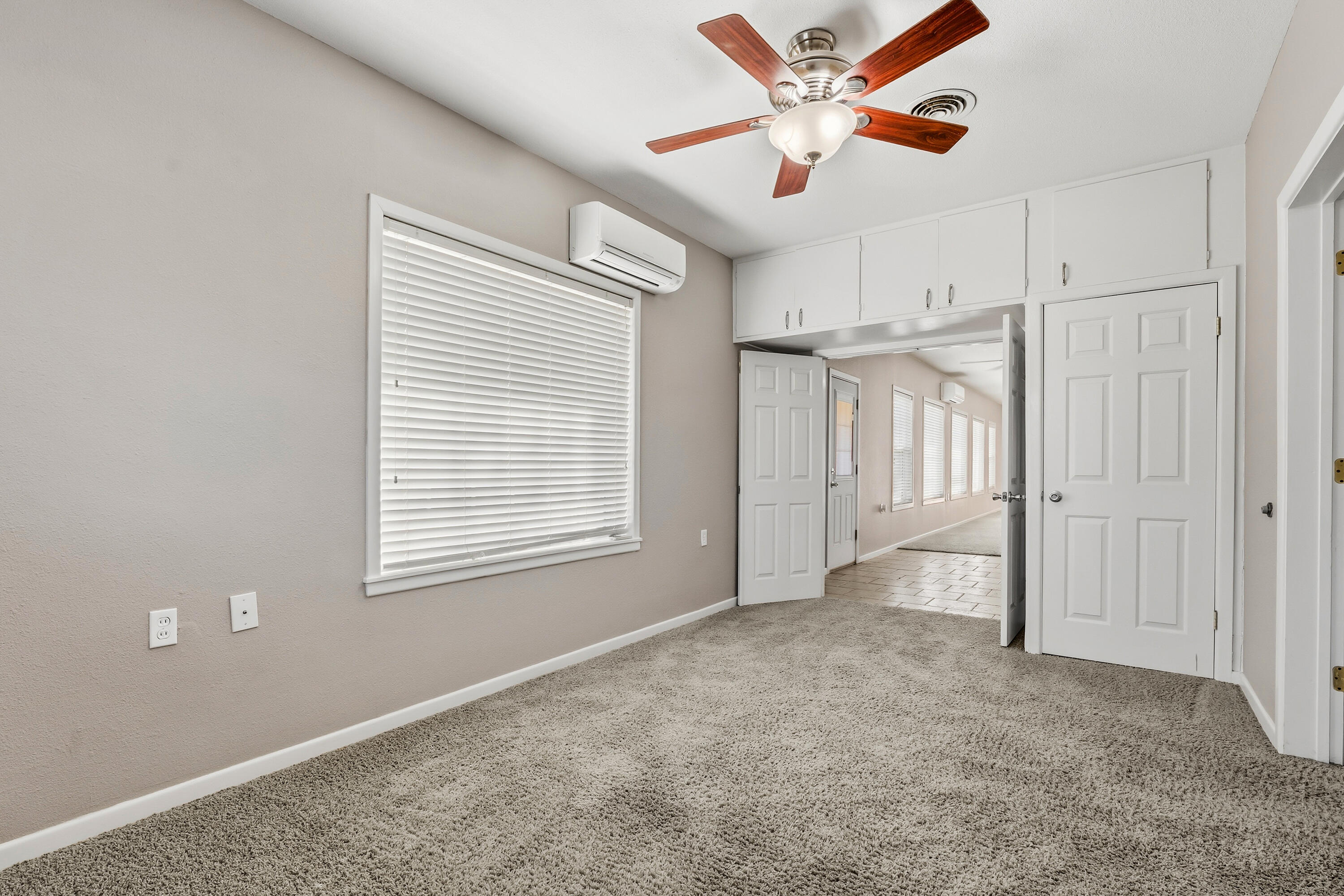 4831 10th Street Lubbock, TX 79416 - Photo 14 of 25 a view of an empty room with a window