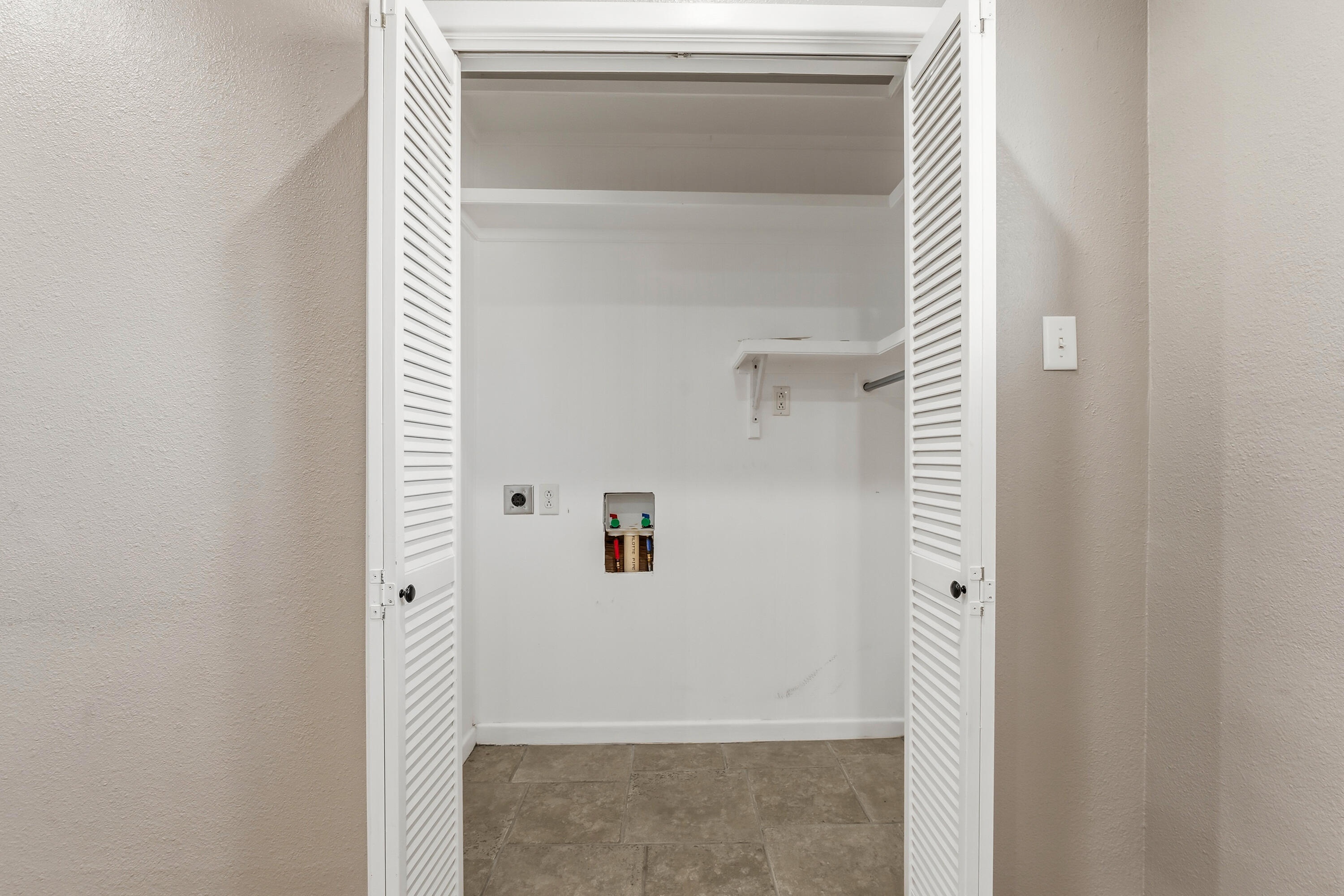 4831 10th Street Lubbock, TX 79416 - Photo 22 of 25 a bathroom with a glass shower door