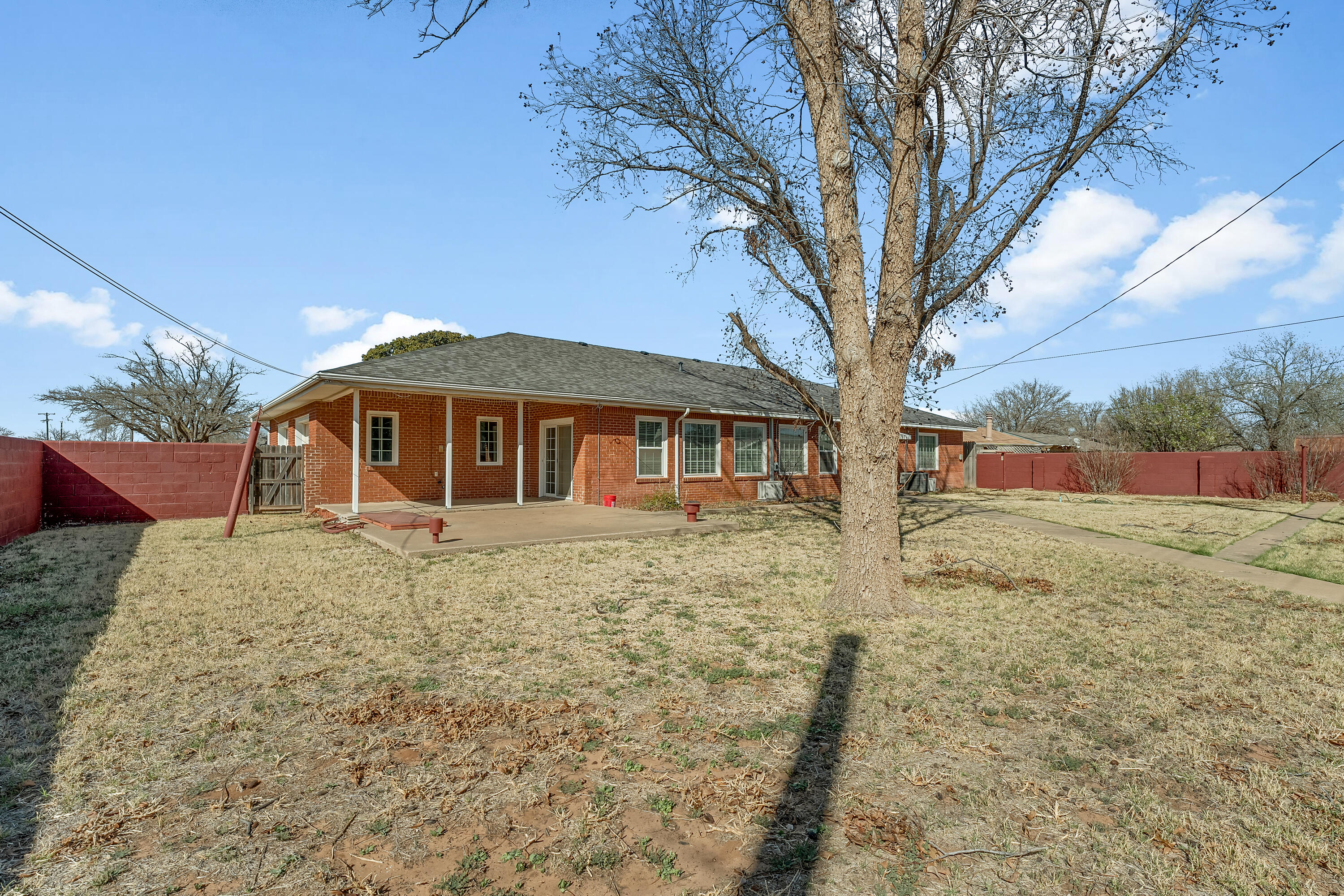 4831 10th Street Lubbock, TX 79416 - Photo 25 of 25 a front view of a house with a yard