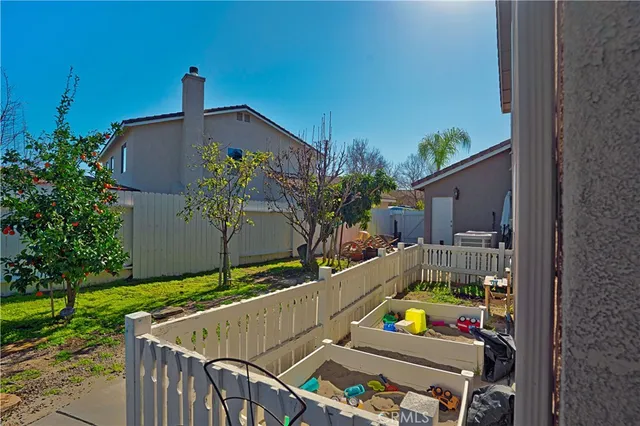 a view of a backyard of the house