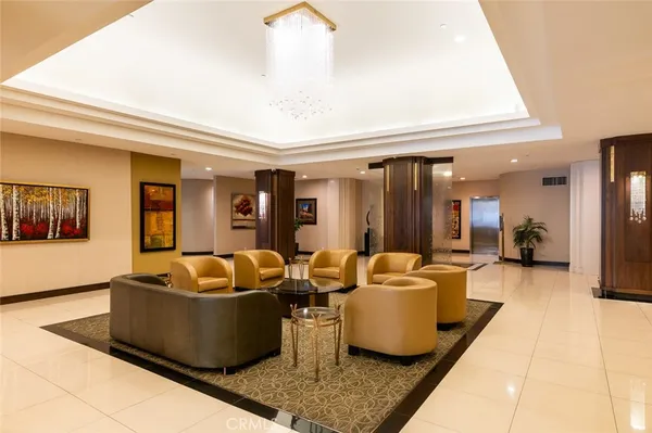a view of a balcony with chairs and wooden floor
