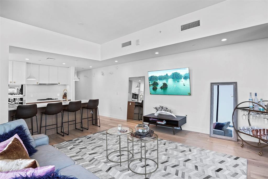 70 Rainey Street, Unit 1409 Austin, TX 78701 - Photo 6 of 38 Living area featuring light wood finished floors and recessed lighting