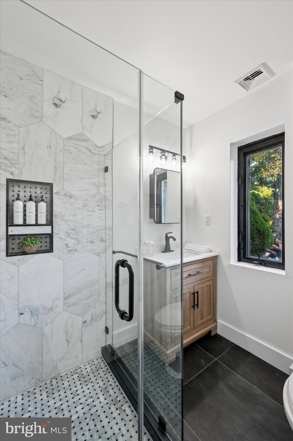 249 Haverford Road Wynnewood, PA 19096 - Photo 17 of 22 Hall Bathroom with Tiled Shower & New Vanity