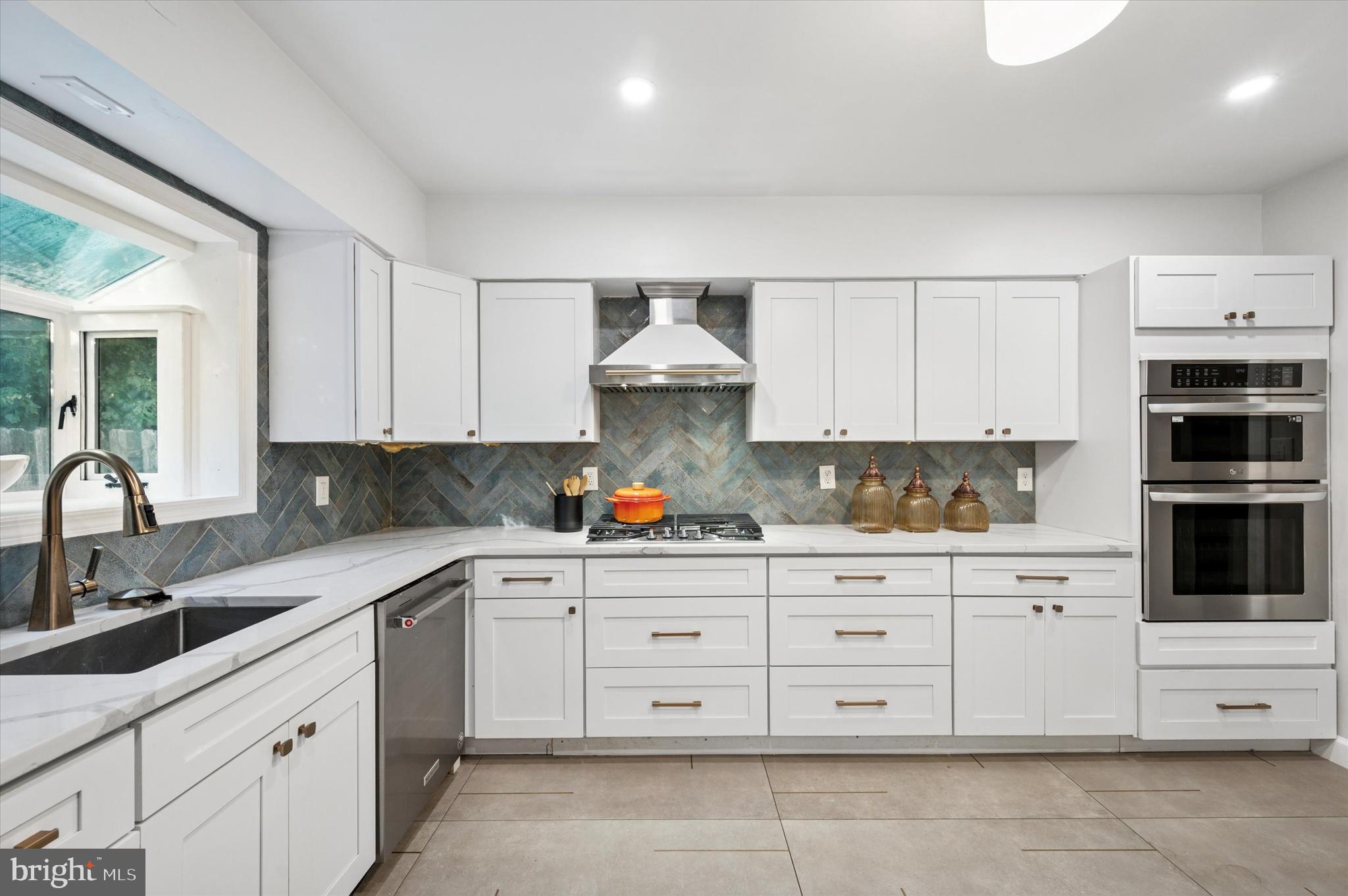 249 Haverford Road Wynnewood, PA 19096 - Photo 5 of 22 Quartz counter tops & herringbone tiled backsplash