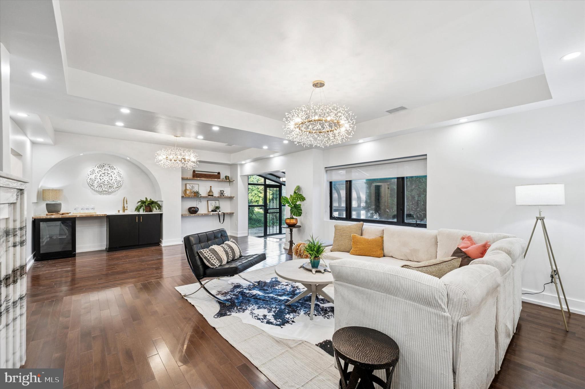 249 Haverford Road Wynnewood, PA 19096 - Photo 6 of 22 Expansive family room with wet bar in arched niche