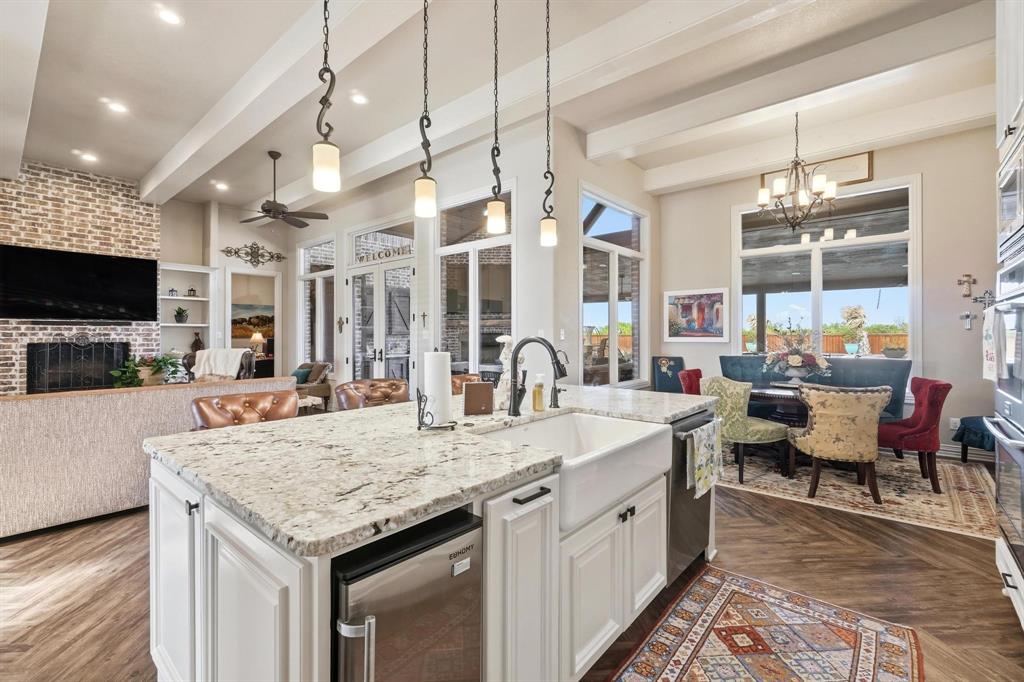 249 Rising Star Drive Abilene, TX 79606 - Photo 9 of 40 a large kitchen with granite countertop a sink and a stove