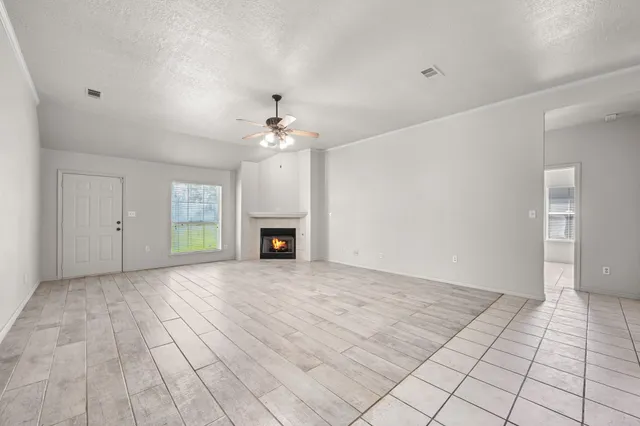 a kitchen with granite countertop a sink stove and cabinets