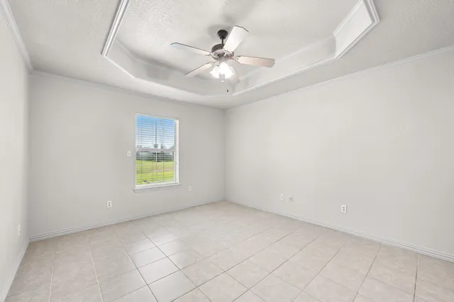 a bathroom with a granite countertop tub sink and mirror