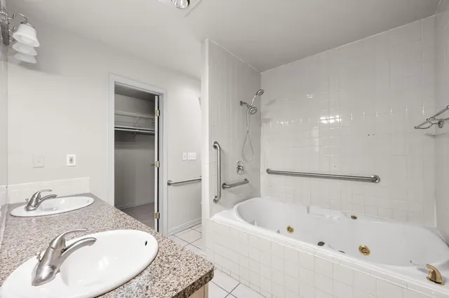 an empty room with a ceiling fan and a window