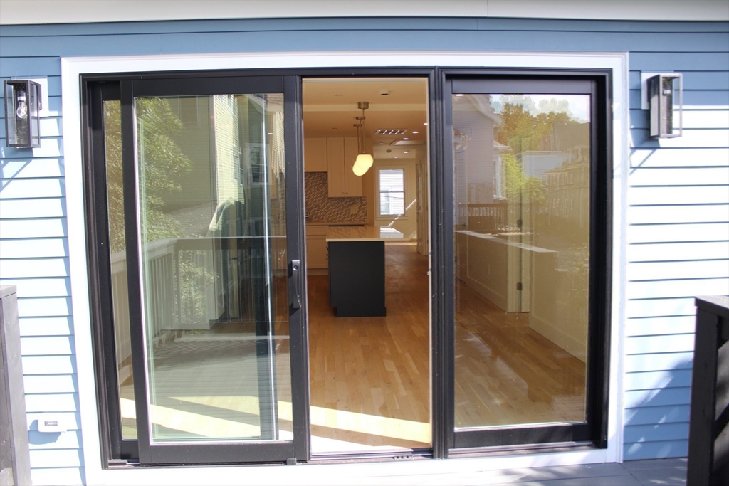 71 Mozart Street, Unit 3 Boston, MA 02130 - Photo 14 of 26 a bathroom with a glass shower door