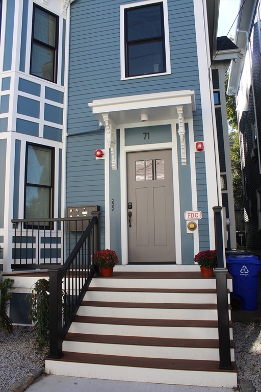 71 Mozart Street, Unit 3 Boston, MA 02130 - Photo 2 of 26 a view of a house with a porch