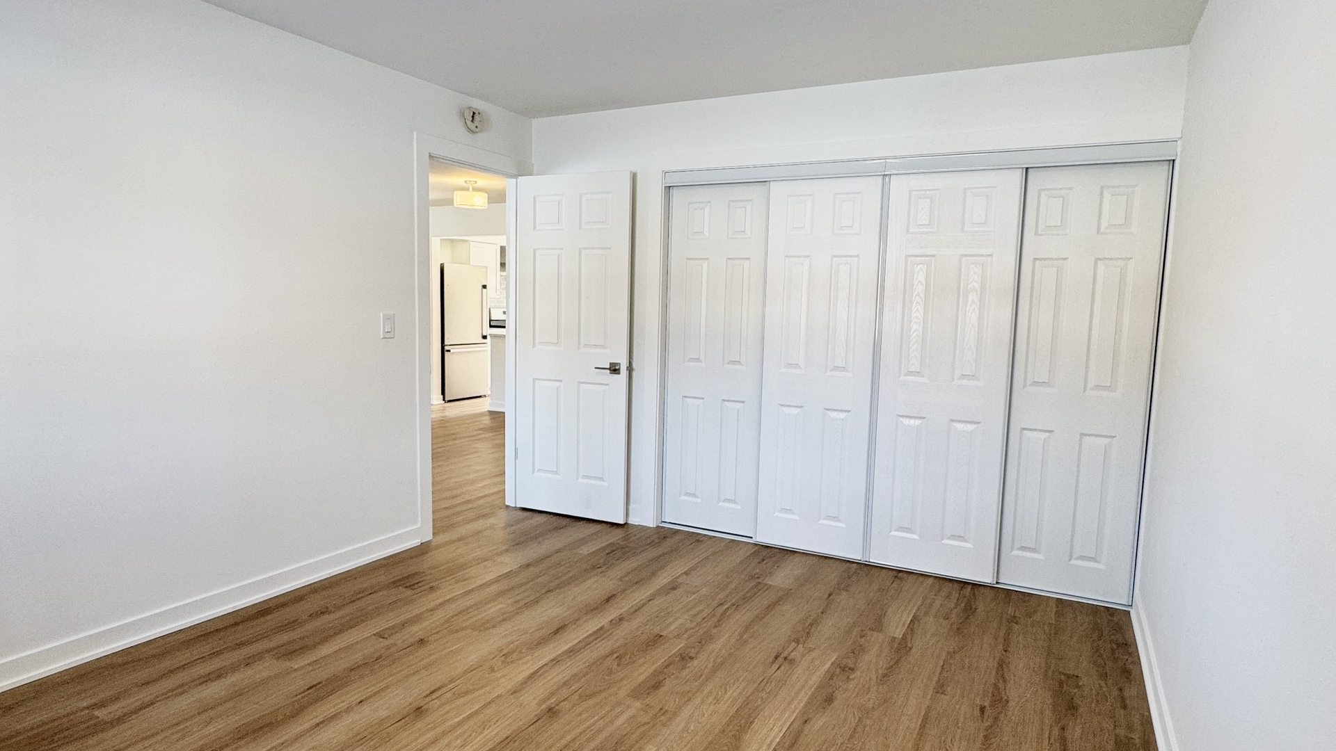 633 Dulles Road, Unit A Des Plaines, IL 60016 - Photo 18 of 26 a view of an empty room with wooden floor