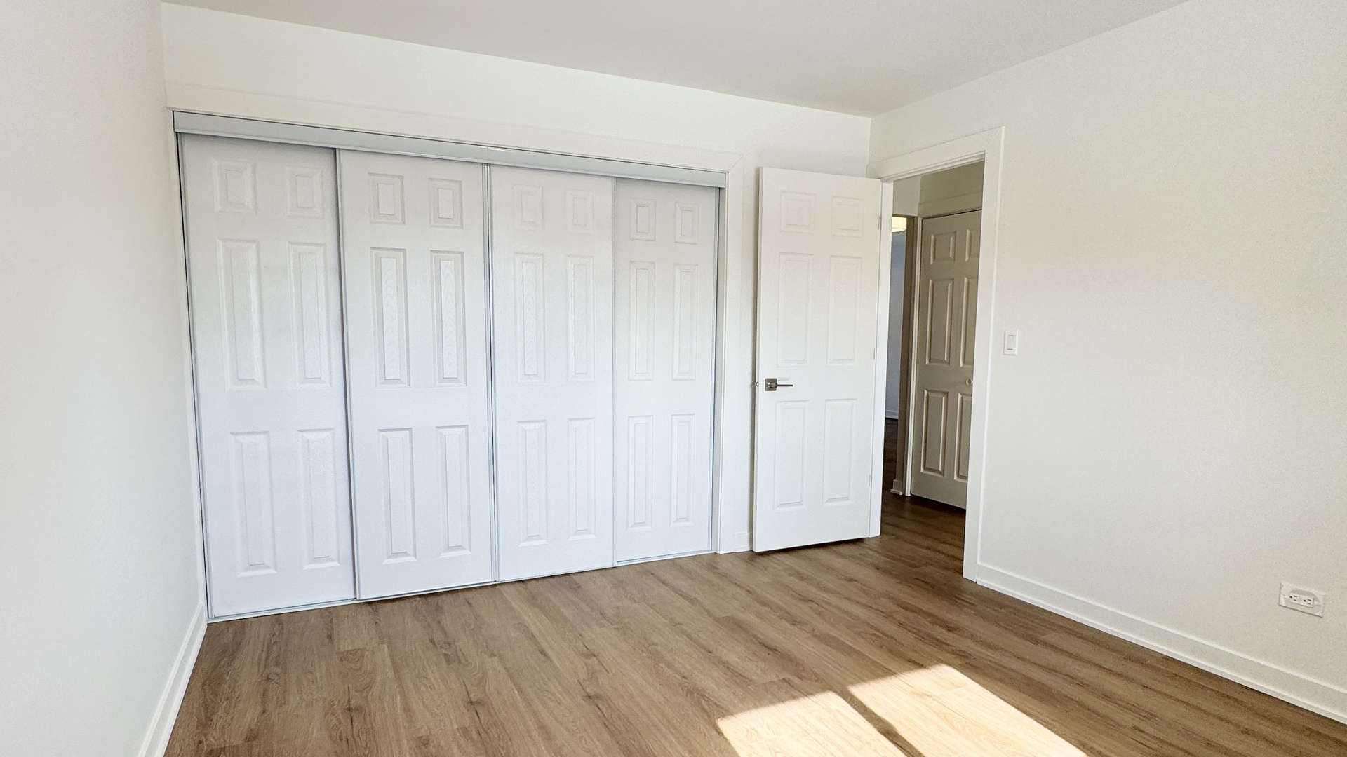 633 Dulles Road, Unit A Des Plaines, IL 60016 - Photo 21 of 26 a view of an empty room with wooden floor