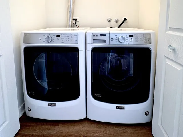 a utility room with dryer and washer