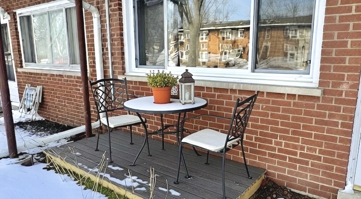 633 Dulles Road, Unit A Des Plaines, IL 60016 - Photo 25 of 26 a view of a room with a table and chairs