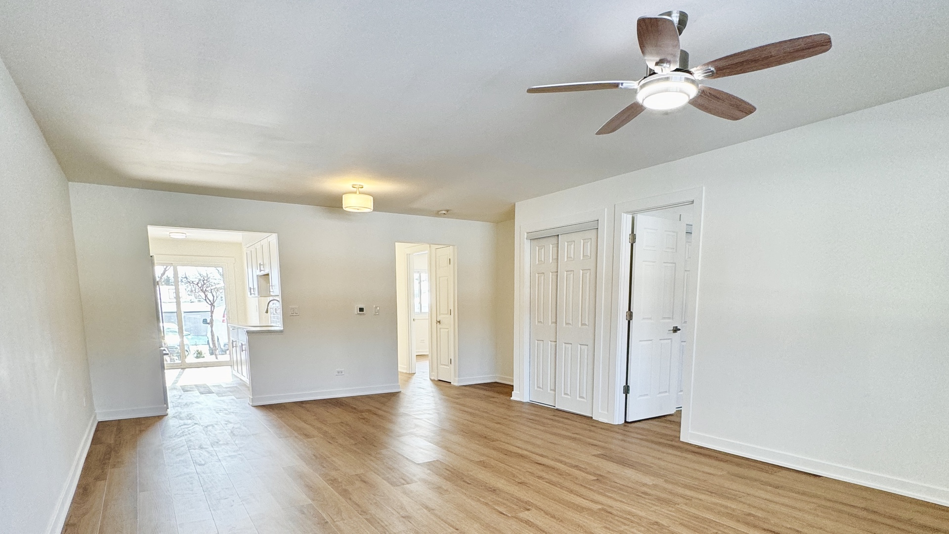 633 Dulles Road, Unit A Des Plaines, IL 60016 - Photo 4 of 26 a view of an empty room with wooden floor