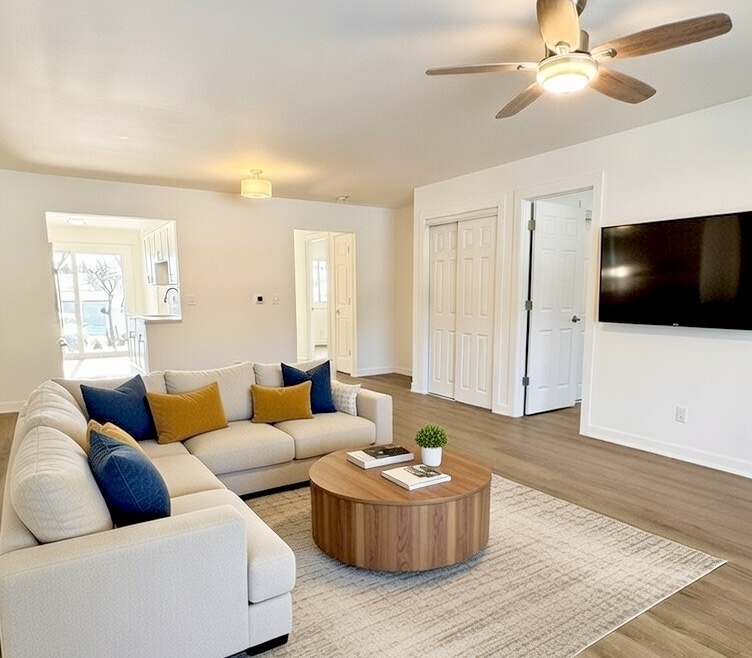 633 Dulles Road, Unit A Des Plaines, IL 60016 - Photo 5 of 26 a living room with furniture and a flat screen tv