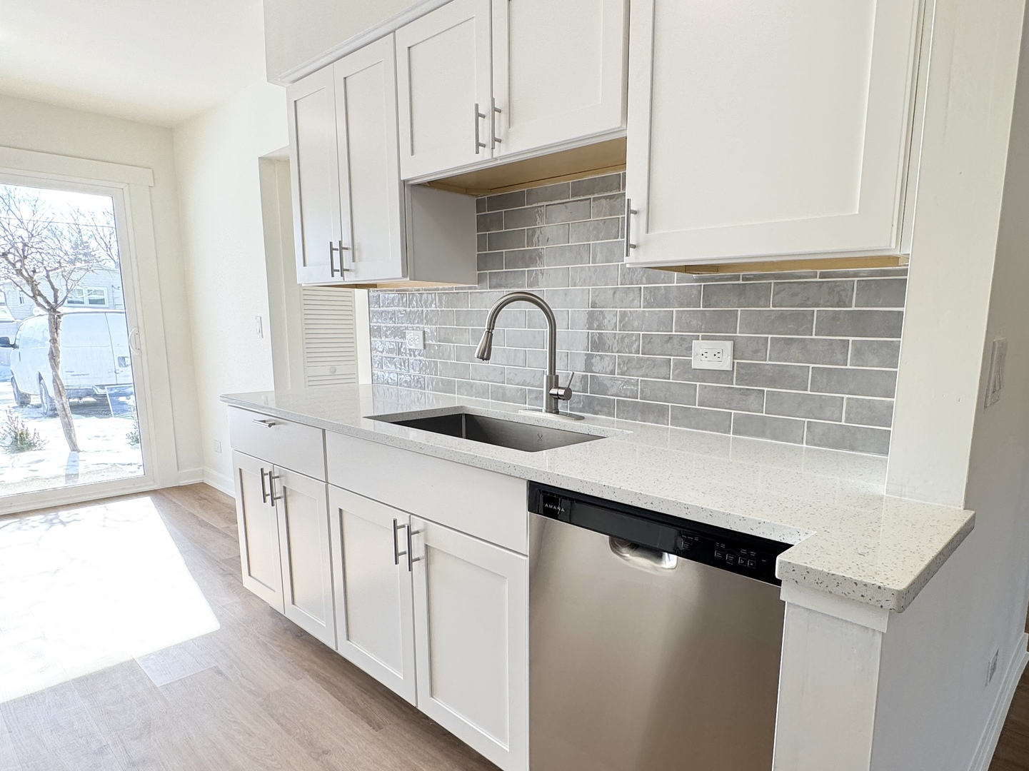 633 Dulles Road, Unit A Des Plaines, IL 60016 - Photo 8 of 26 a kitchen with stainless steel appliances a sink stove and cabinets