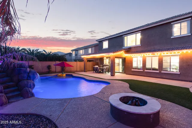 a swimming pool with outdoor seating