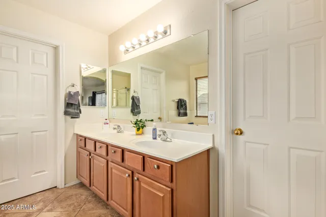 a view of a livingroom with workspace and a window