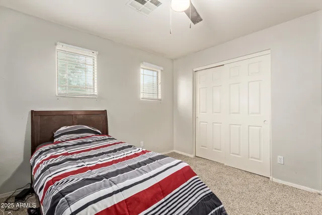 a white toilet sitting next to a bath tub