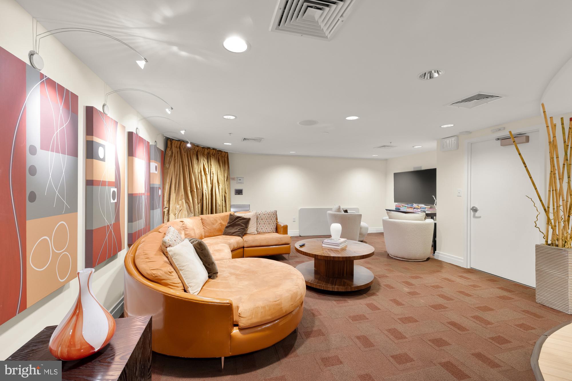 915 E Street Northwest, Unit 815 Washington, DC 20004 - Photo 24 of 26 Modern lounge with vibrant artwork accents.