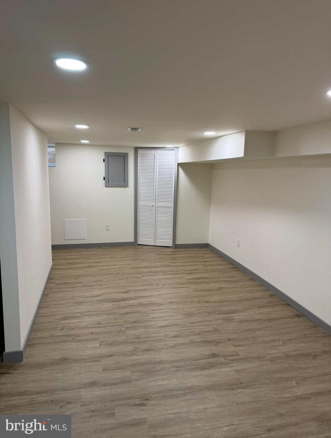 7816 Temple Road Philadelphia, PA 19150 - Photo 21 of 24 an empty room with wooden floor and windows
