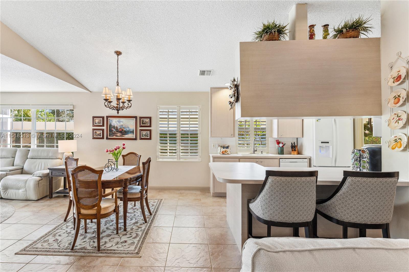 256 Brier Circle Jupiter, FL 33458 - Photo 13 of 50 a dining room with furniture and window