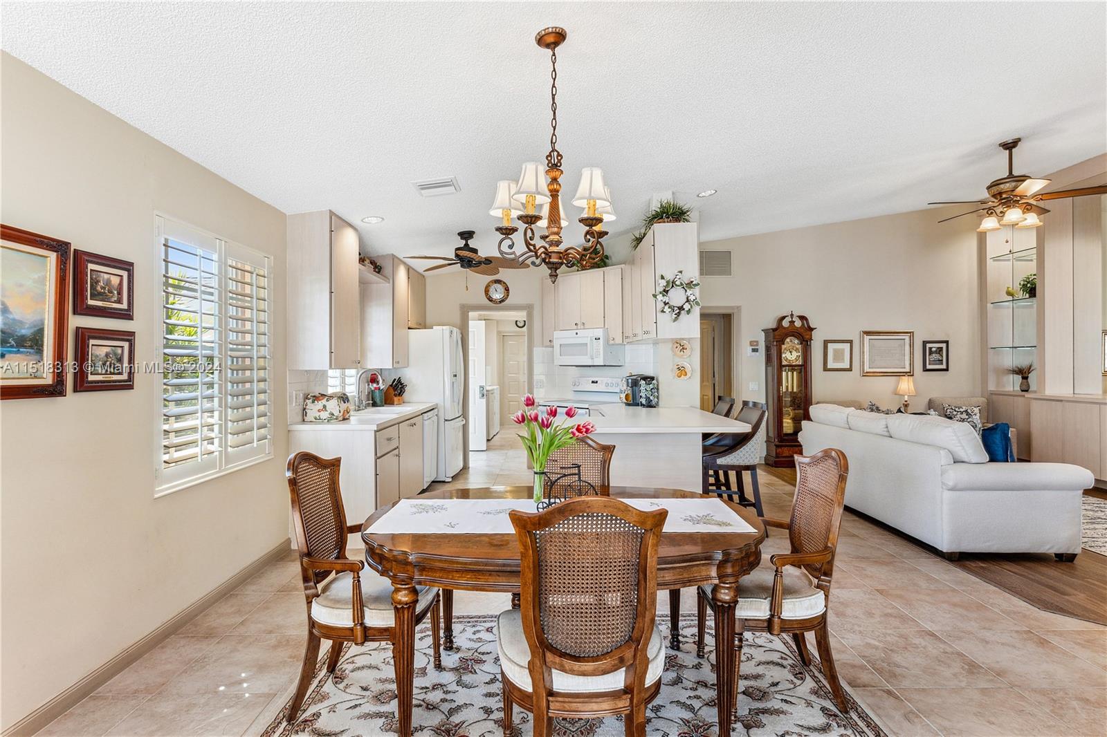 256 Brier Circle Jupiter, FL 33458 - Photo 18 of 50 a view of a dining room with furniture and window