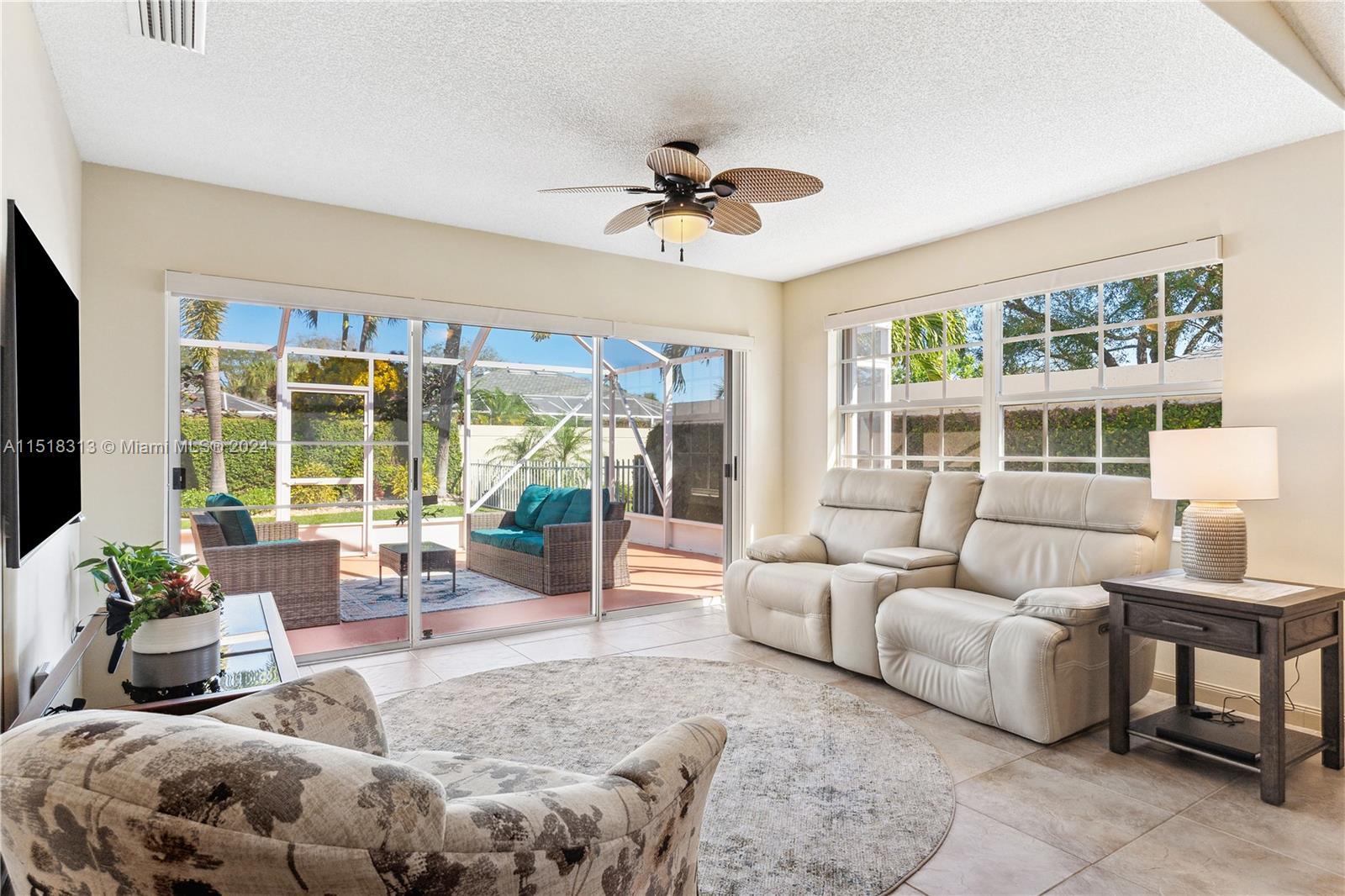 256 Brier Circle Jupiter, FL 33458 - Photo 19 of 50 a living room with furniture and a large window