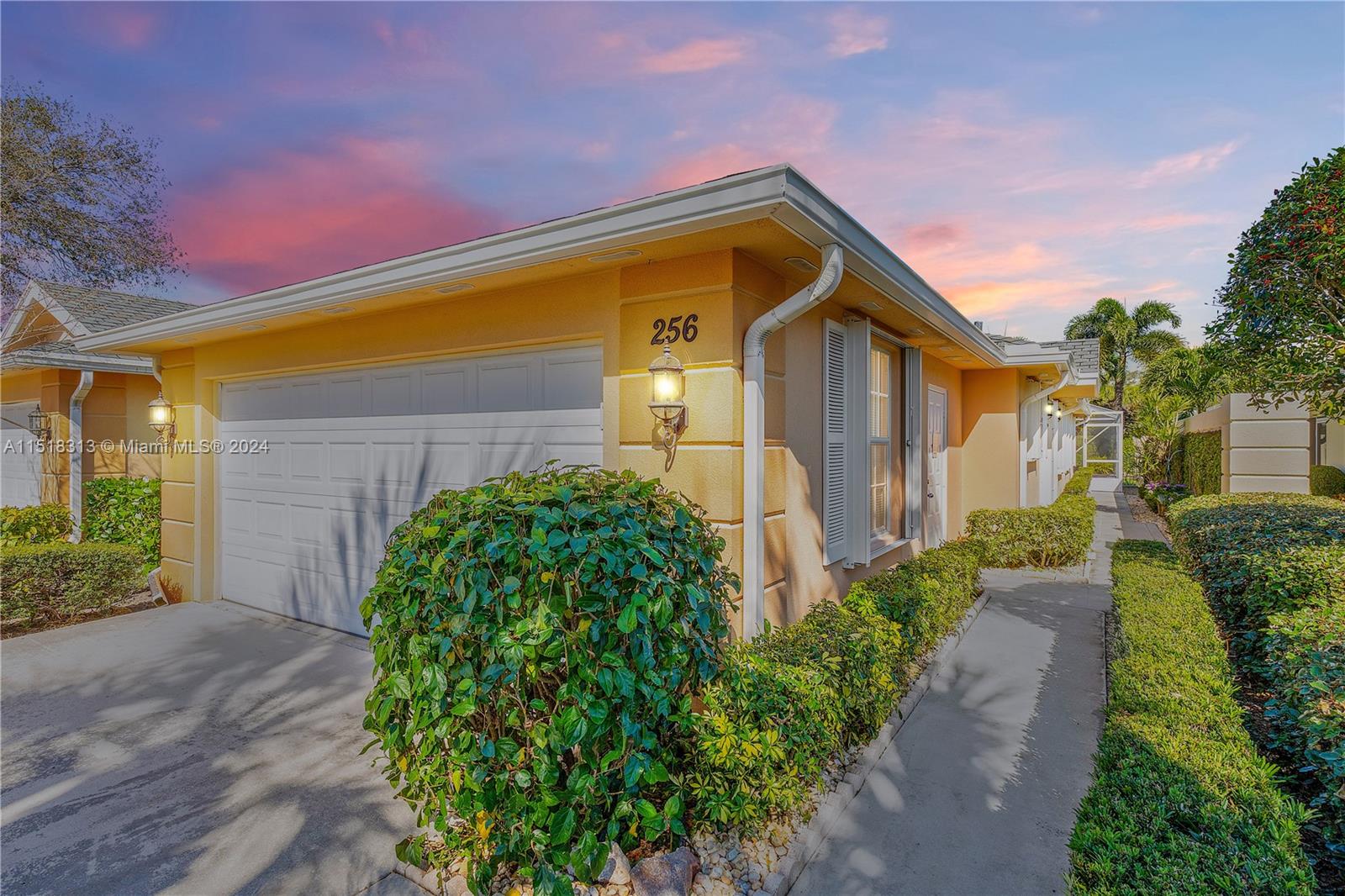 256 Brier Circle Jupiter, FL 33458 - Photo 2 of 50 a front view of a house with garden