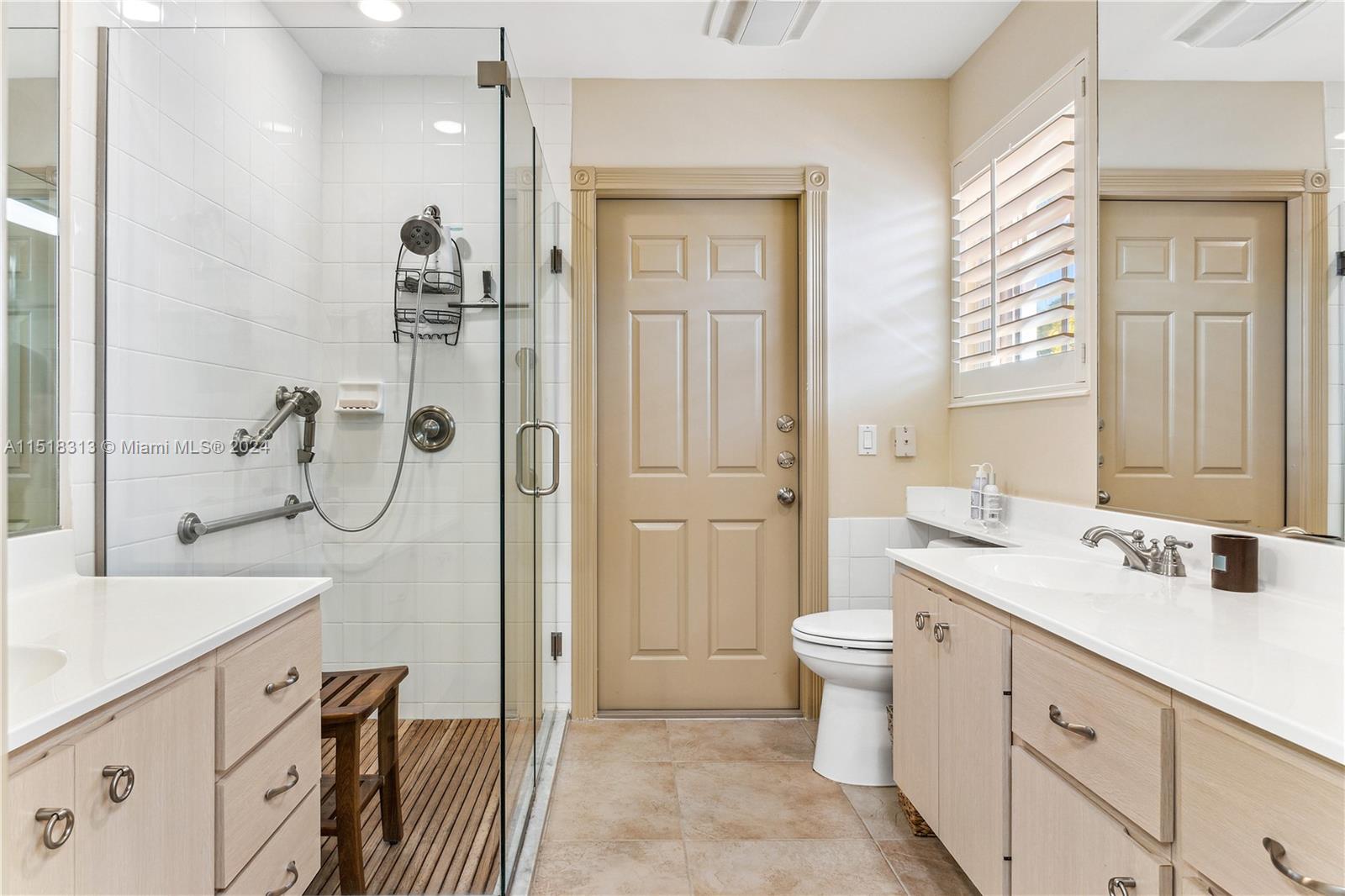256 Brier Circle Jupiter, FL 33458 - Photo 24 of 50 a bathroom with a sink a toilet and shower