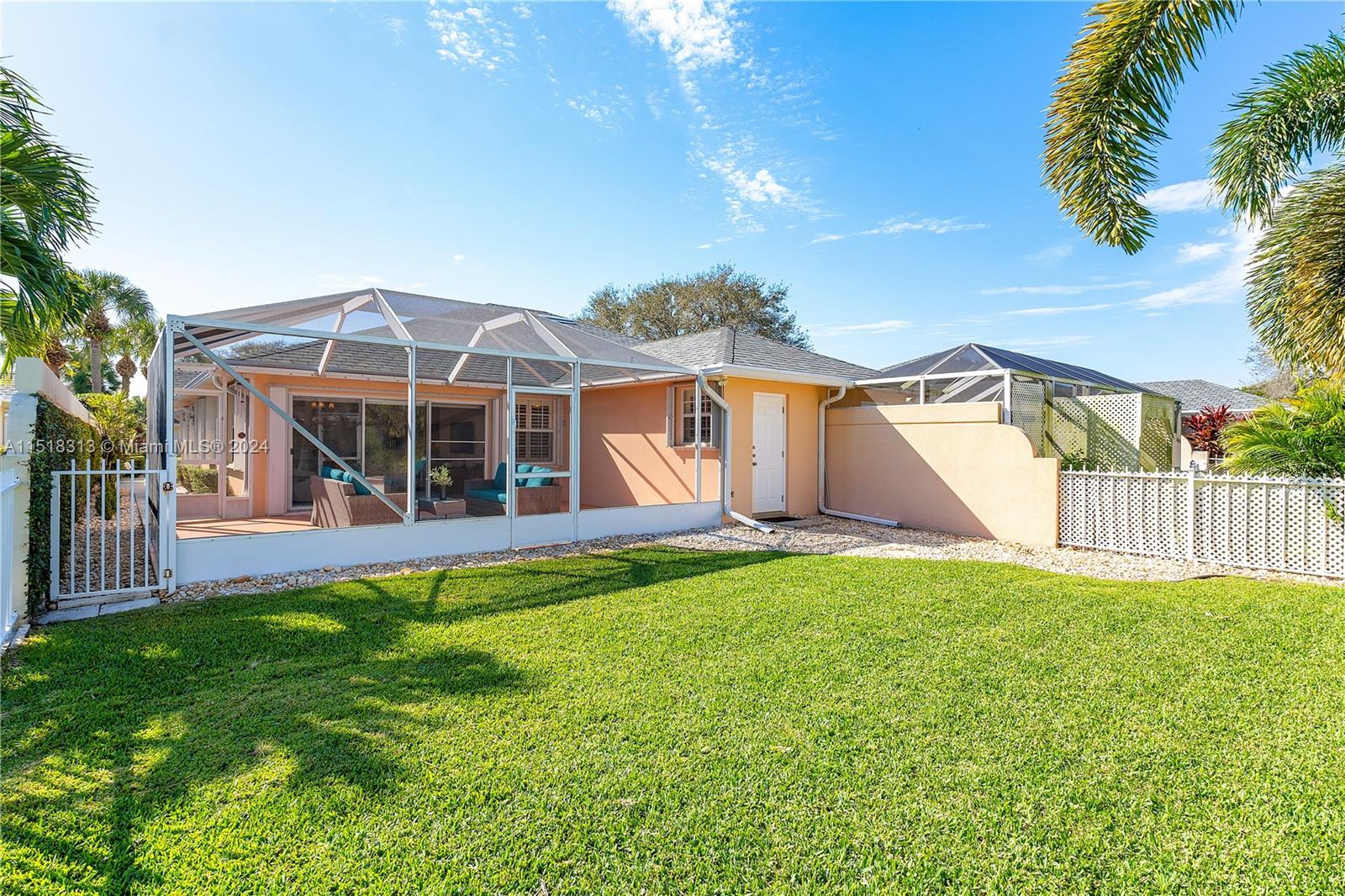 256 Brier Circle Jupiter, FL 33458 - Photo 32 of 50 a view of a house with backyard and porch