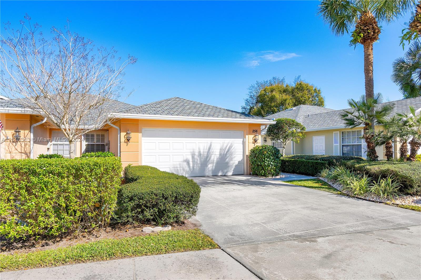 256 Brier Circle Jupiter, FL 33458 - Photo 35 of 50 a front view of a house with garden