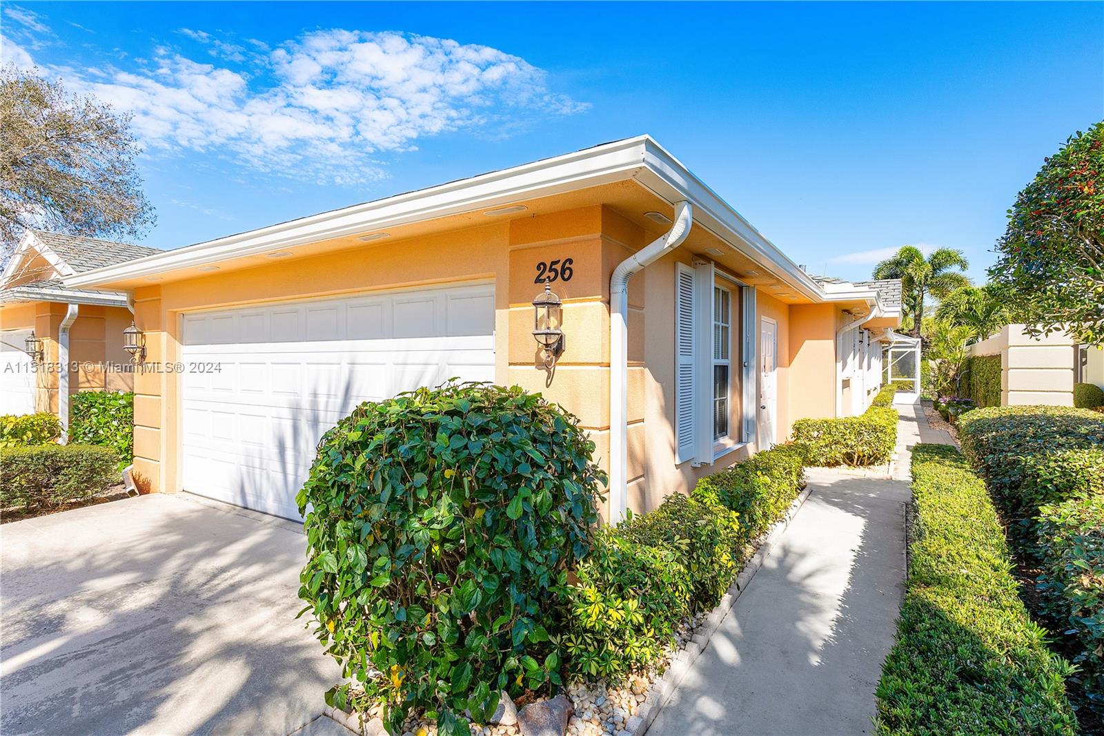 256 Brier Circle Jupiter, FL 33458 - Photo 36 of 50 a front view of a house with garden