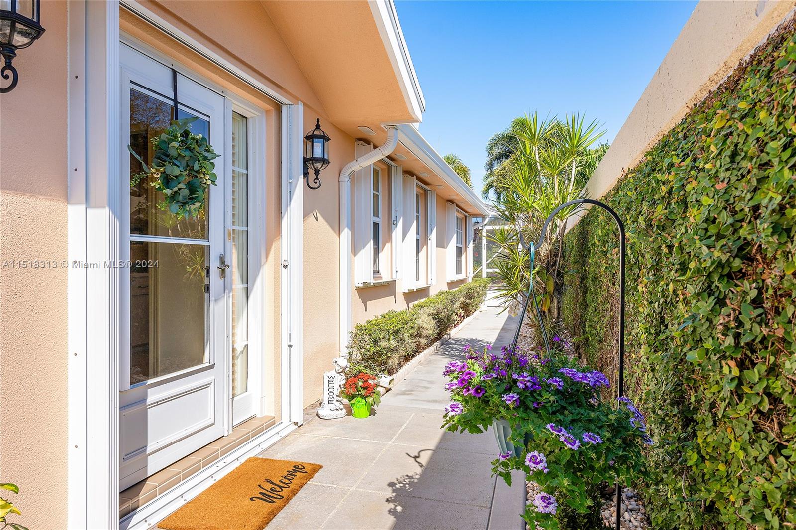 256 Brier Circle Jupiter, FL 33458 - Photo 38 of 50 a view of a house with a yard and flower plants