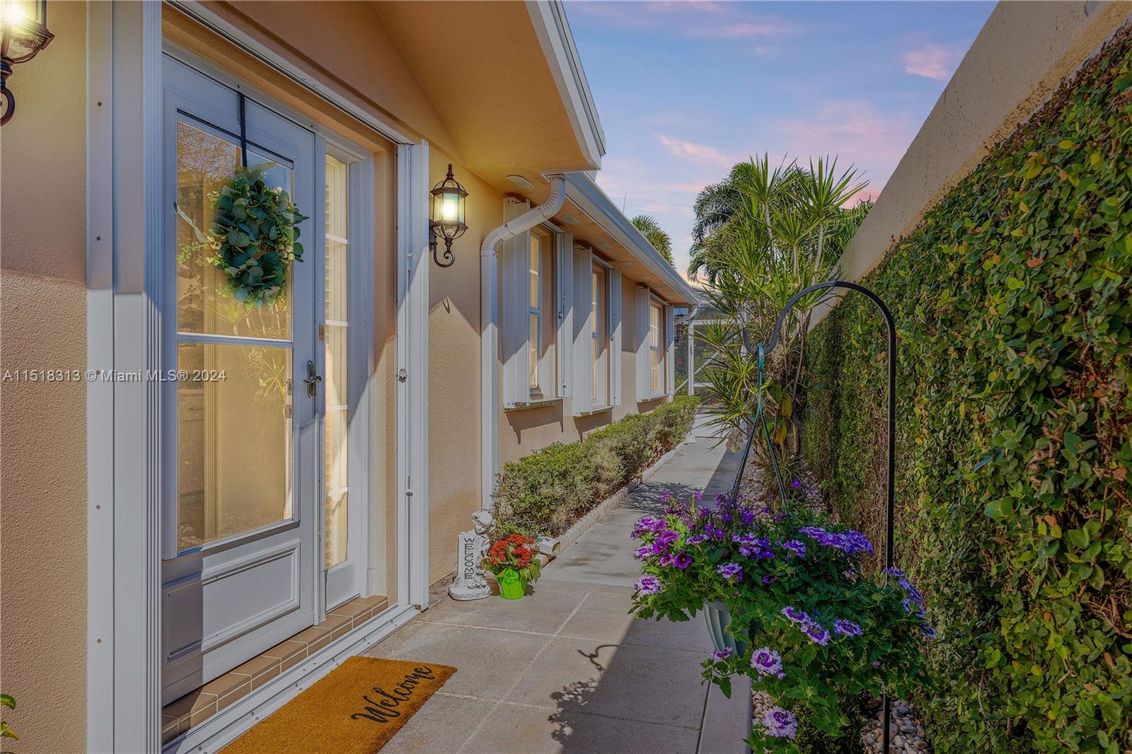 256 Brier Circle Jupiter, FL 33458 - Photo 4 of 50 a view of backyard with garden and flowers