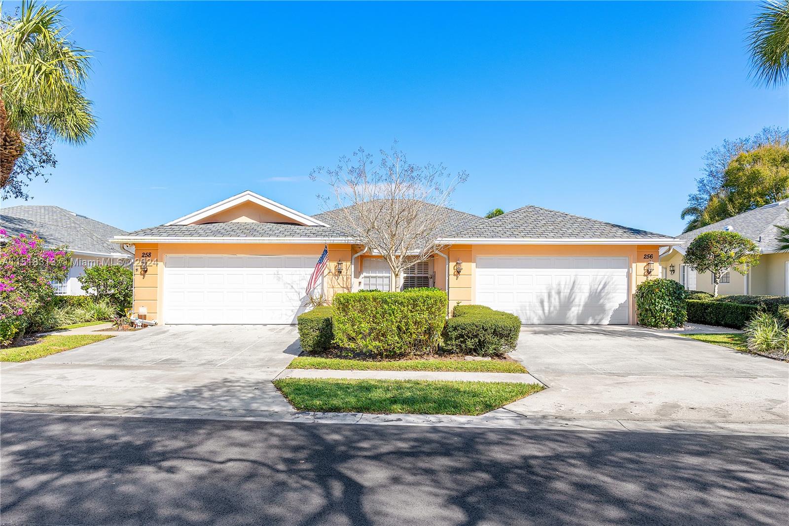 256 Brier Circle Jupiter, FL 33458 - Photo 7 of 50 a front view of a house with garden