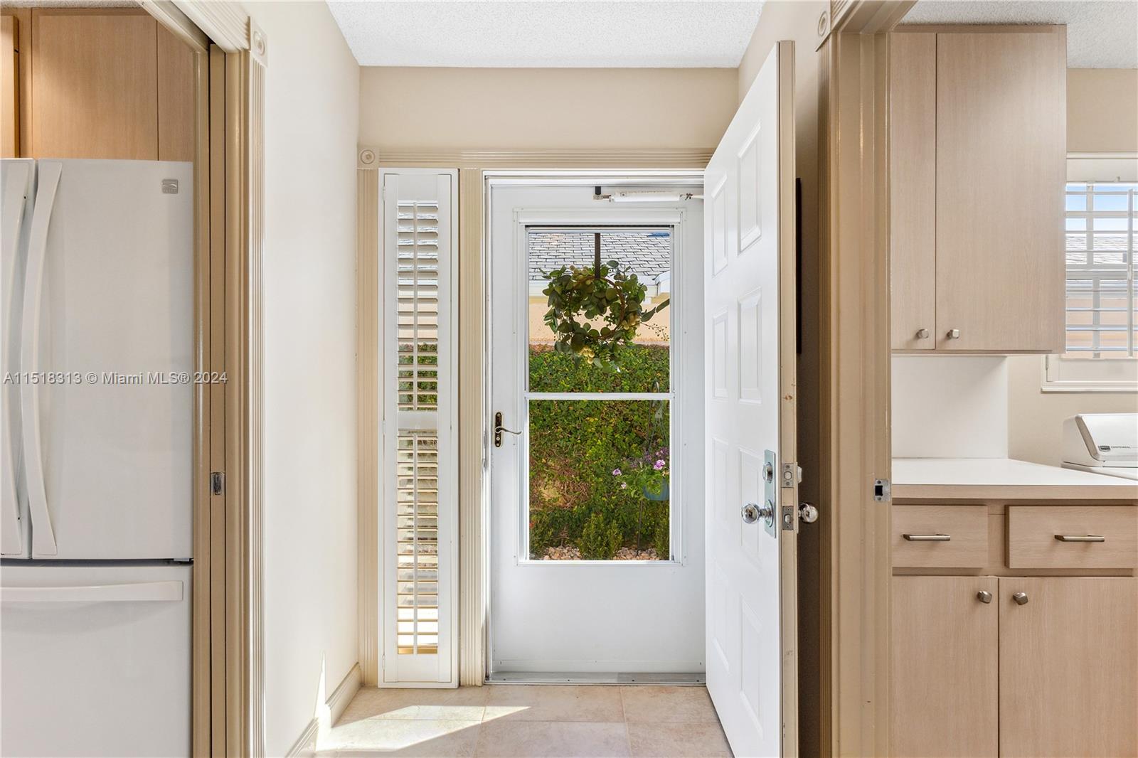 256 Brier Circle Jupiter, FL 33458 - Photo 9 of 50 a view of a bathroom with a door and a white door
