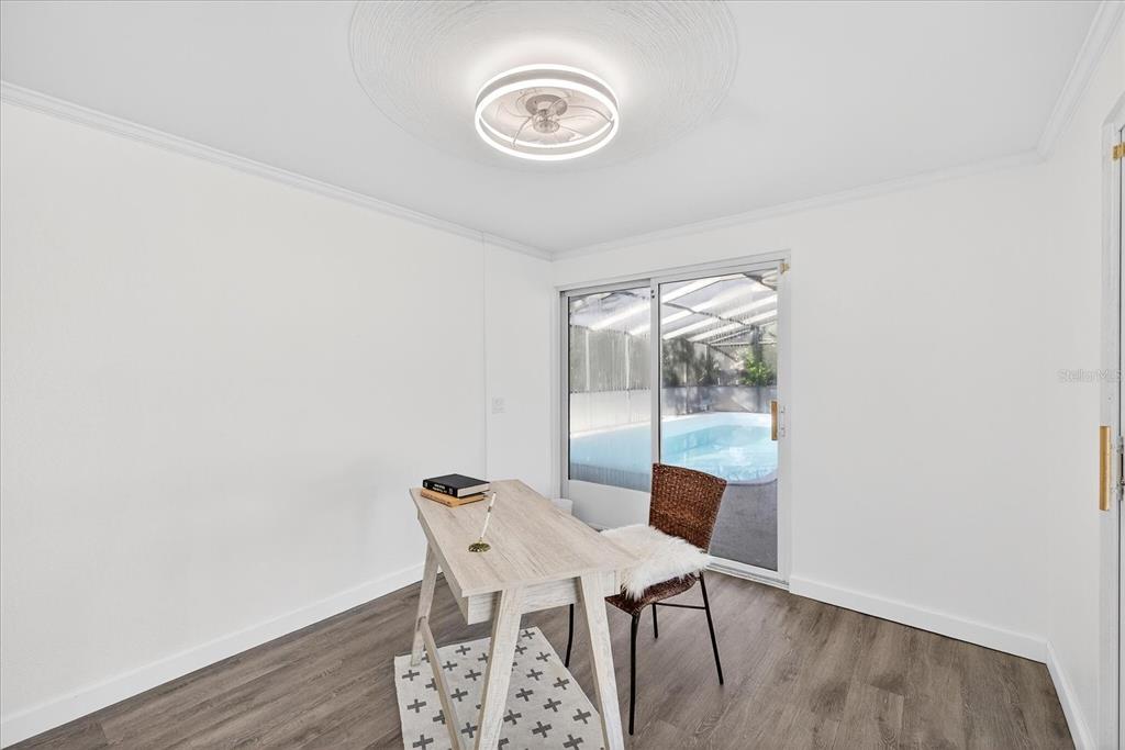 4928 Amherst Court New Port Richey, FL 34652 - Photo 13 of 50 a view of a dining room with a table and chairs
