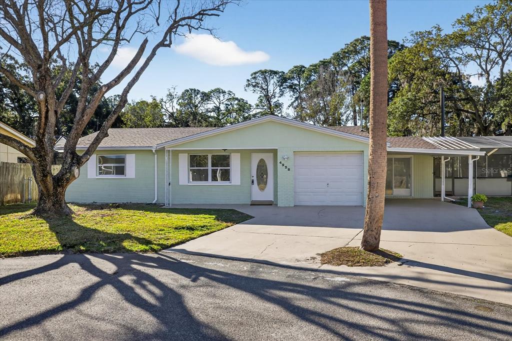 4928 Amherst Court New Port Richey, FL 34652 - Photo 18 of 50 a view of a house with backyard and sitting area