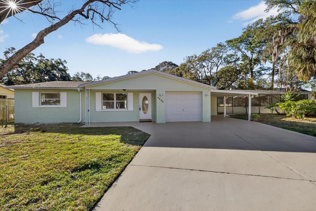 4928 Amherst Court New Port Richey, FL 34652 - Photo 19 of 50 a view of house with swimming pool in front of it