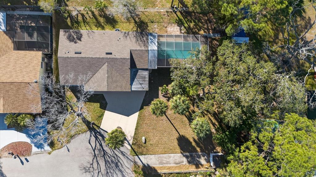 4928 Amherst Court New Port Richey, FL 34652 - Photo 22 of 50 an aerial view of a house with swimming pool