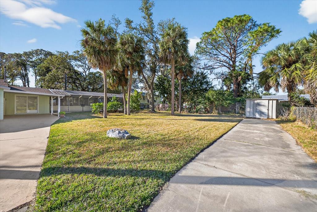 4928 Amherst Court New Port Richey, FL 34652 - Photo 24 of 50 a view of swimming pool with a backyard