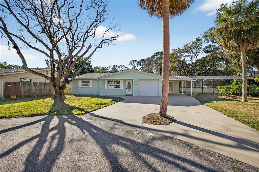 4928 Amherst Court New Port Richey, FL 34652 - Photo 27 of 50 a view of a house with pool and yard