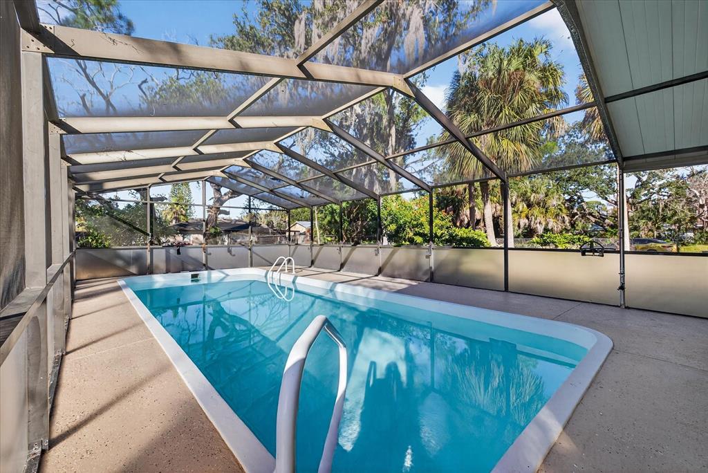 4928 Amherst Court New Port Richey, FL 34652 - Photo 45 of 50 a view of a backyard with sitting area