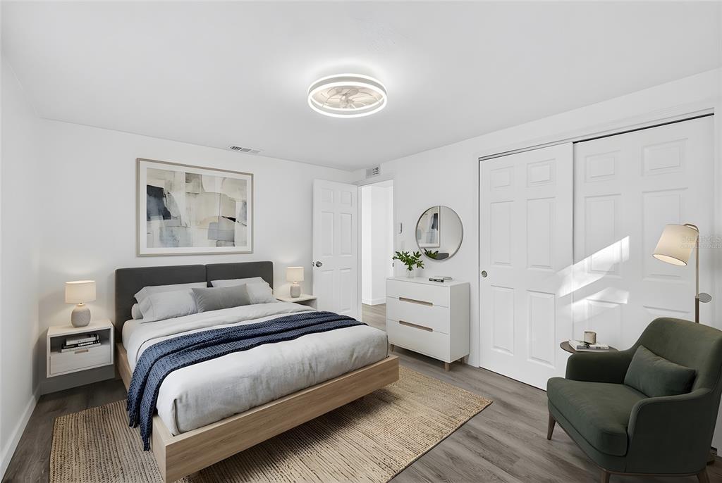 4928 Amherst Court New Port Richey, FL 34652 - Photo 9 of 50 a bedroom with bed and window