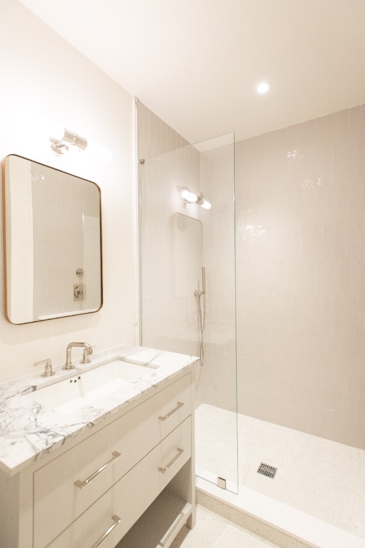 10 Silver Street Nantucket, MA 02554 - Photo 48 of 48 a bathroom with a granite countertop sink mirror and bathtub