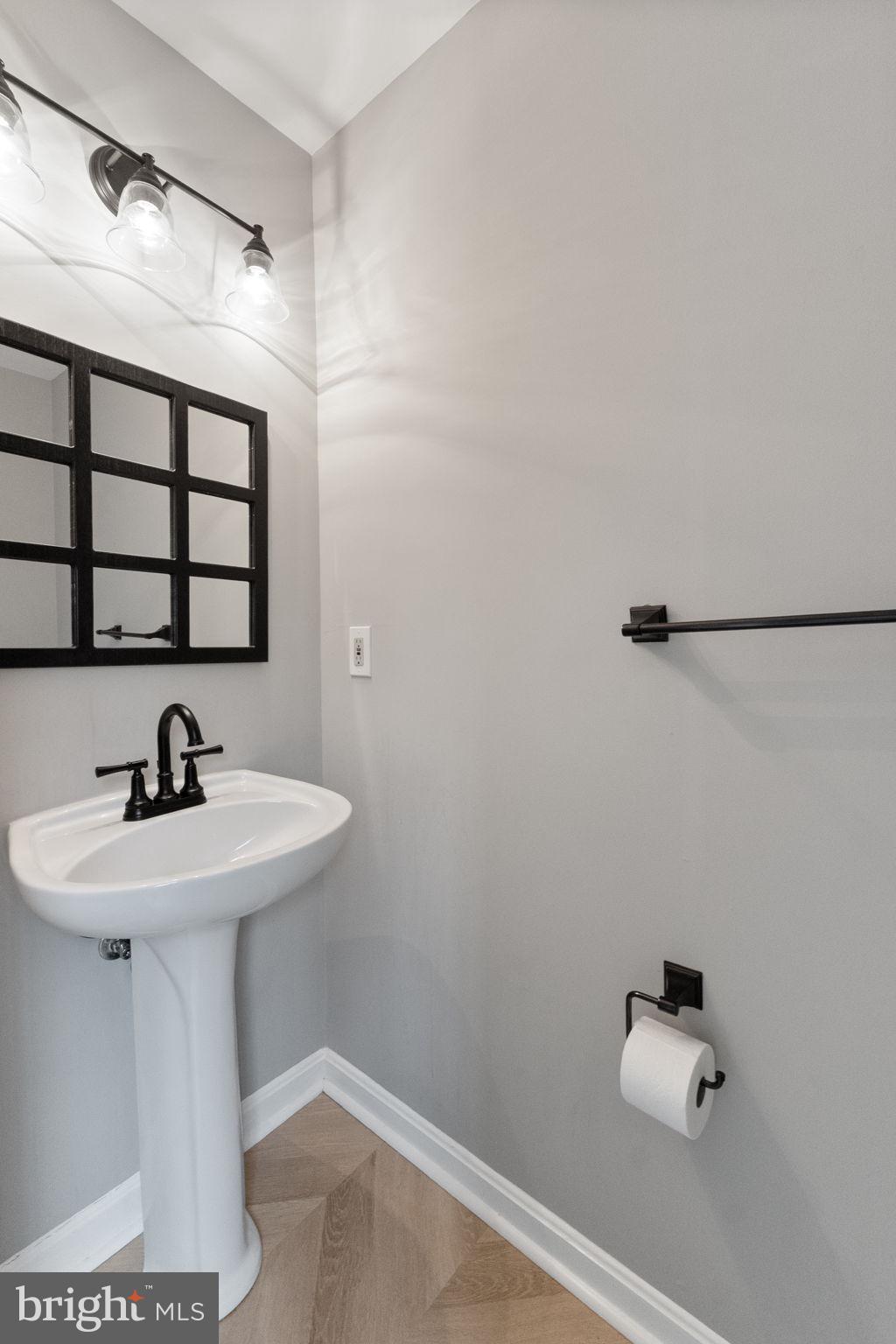1527 Lincoln Road Shady Side, MD 20764 - Photo 9 of 30 a bathroom with a sink and mirror