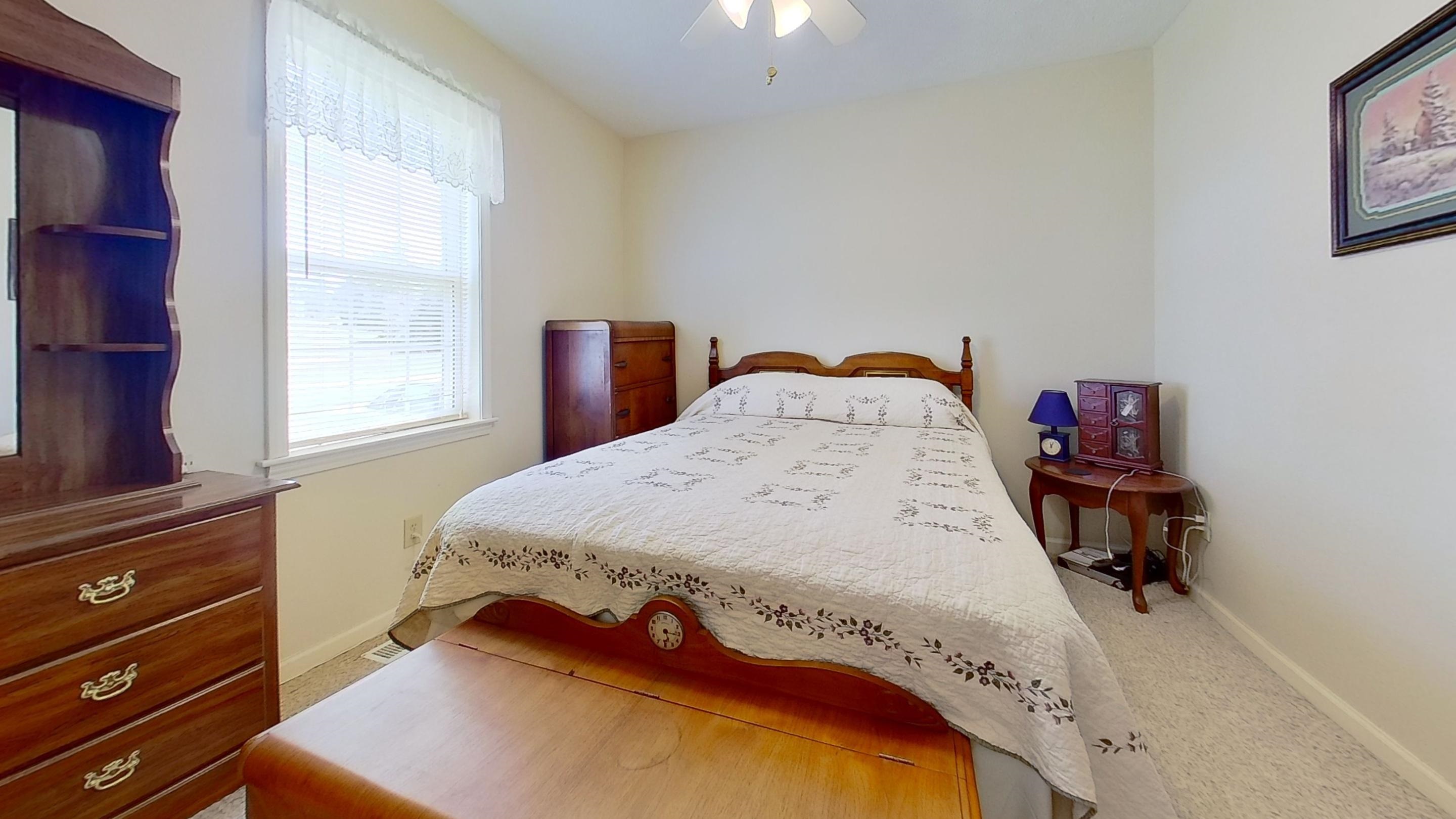 30 Rodeo Way Savannah, TN 38372 - Photo 11 of 29 Bedroom with a ceiling fan and light carpet